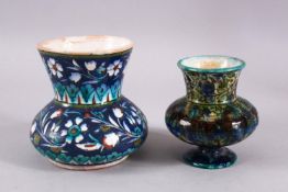 TWO JERUSALEM PALESTINIAN POTTERY FLORAL VASES, each with varying floral motif decoration, 13cm &