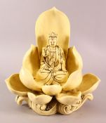 A CHINESE BLANC DE CHINE FIGURE OF GUANYIN & LOTUS, the body with a yellow hue, the verso with a