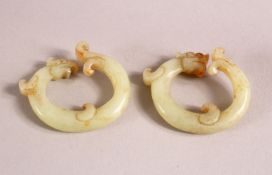 A CHINESE CARVED JADE TWO DRAGON LINK RING, 4cm each.