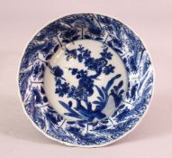 A SMALL CHINESE KANGXI PERIOD BLUE & WHITE PORCELAIN SAUCER DISH, with floral decoration the base