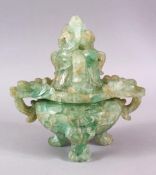 A CHINESE CARVED GREEN QUARTZ TWIN HANDLE VASE AND COVER, with lion dog carved finial's, upon tripod