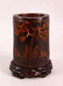 A CHINESE LACQUERED BAMBOO BRUSH WASH AND STAND, the body decorated with birds in landscapes, 19cm