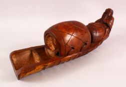 A 20TH CENTURY CHINESE BAMBOO CARVING of a figure on a raft with barrel, 48cm long.