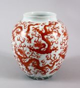 A CHINESE FAMILLE ROSE DRAGON JAR, painted with red dragons and with wave decoration to lower, the