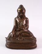 A BRONZE BUDDHA with glass inset eyes, 16cm high.