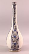 A PERSIAN QAJAR BLUE & WHITE POTTERY VASE, with bands of floral decoration, 41cm