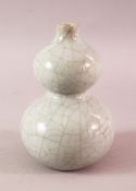 A 19TH / 20TH CENTURY CHINESE CRACKLE GROUND CELADON DOUBLE GOURD PORCELAIN VASE, the base with a