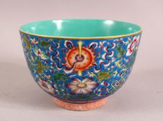 A CHINESE FAMILLE ROSE & TRUQUOISE PORCELAIN BOWL, decorated with precious objects and flora, the