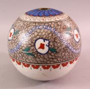 AN IZNIK TURKISH POTTERY HANGING BALL FOR MOSQUE, decorated with a white glaze with motif