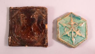 TWO 16TH / 17TH CENTURY POTTERY TILE SECTIONS, one with a turquoise glaze and floral motis moulding,