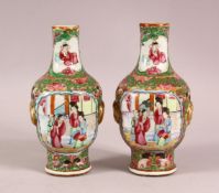 A PAIR OF 19TH CENTURY CHINESE CANTON FAMILLE ROSE PORCELAIN VASES, with panelled figural decoration