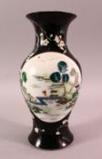 A 19TH CENTURY CHINESE FAMILLE NOIR PORCELAIN VASE, the black ground decorated with panels of