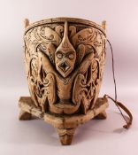 A 19TH / 20TH CENTURY INDIAN CARVED WOODEN BABY CARRIER, Carved with mythical beasts and foliage,