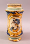 A GOOD EUROPEAN SUBJECT POTTERY MEDICINE JAR, decorated with a figure and flora, 23.5cm
