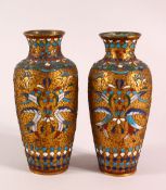 A SMALL PAIR OF CLOISONNE AND RAISED WIRE VASES, 16cm high.