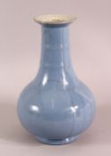 A CHINESE SKY BLUE CRACKLE GLAZED PORCELAIN VASE, 23cm.