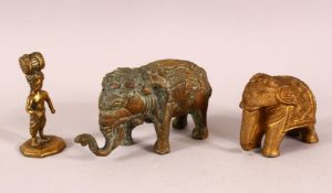THREE INDIAN GILT METAL FIGURES, two elephant and a figure.