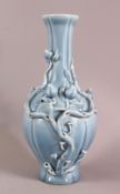 A CHINESE SKY BLUE GLAZED MOULDED PEACH BRANCH PORCELAIN VASE, the body decorated with moulded peach