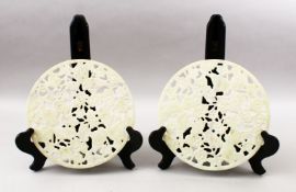 TWO 20TH CENTURY CHINESE CARVED HARDSTONE / JADELIKE BI - DISKS, each disk carved with koi carp