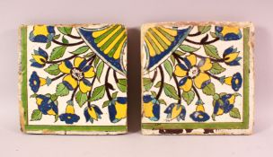 A PAIR OF 17TH/18TH CENTURY PERSIAN SAFAVID POTTERY TILES, each painted with floral sprays, 22cm