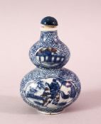 A CHINESE BLUE AND WHITE GOURD SHAPED PORCELAIN SNUFF BOTTLE, painted to each side with a figure