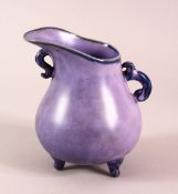 A CHINESE SONG STYLE AUBERGINE GLAZE WINE POT, with tripod feet, the base with a mark, 13cm high.