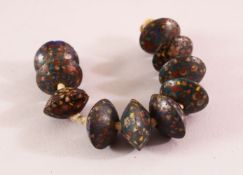 AN UNUSUAL SET OF TEN CHINESE POSSIBLY MING CLOISONNE BEADS, approx. 20mm diameter each.