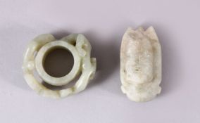TWO CHINESE CARVED JADE PENDANTS, one carved with chilong, 5cm, and one carved int he form of a