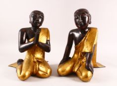 A PAIR OF LARGE THAI / TIBET CARVED WOOD & LACQUER FIGURES, both in knealt positions in gilded