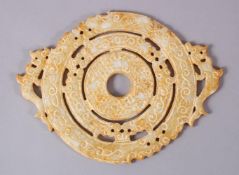 A CHINESE CARVED SOAPSTONE BI DISK, carved in archaic form with chilong, 22cm