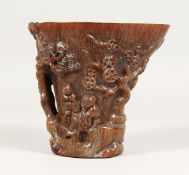 A CARVED HORN LIBATION CUP, 5.5ins.