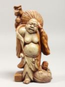 A CHINESE CARVED SOAPSTONE FIGURE, 7.5ins high.