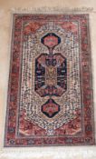 A SMALL PERSIAN RUG with large medallion. 5ft x 2ft 8ins.