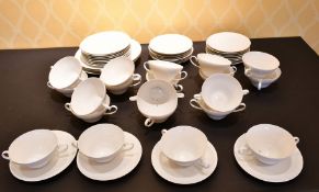 A ROSENTHAL STUDIO-LINE SET OF TWENTY TWO-HANDLED BOWLS AND STANDS, THREE LARGE PLATES AND EIGHT