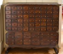 A CHINESE NARROW CABINET with SIXTY-TWO DRAWERS. 3ft 9ins long x 1ft deep x 3ft 4ins high.