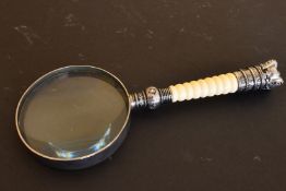 A MAGNIFYING GLASS.