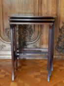 AN EDWARDIAN MAHOGANY NEST OF THREE TABLES.Largest: 1ft 10ins.