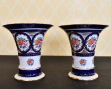 A PAIR OF SEVRES DESIGN FLORAL TRUMPET SHAPED VASES. 8ins high.