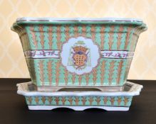 A FRENCH PORCELAIN CHINESE PATTERN JARDINIERE AND STAND with crest. 1ft 5ins wide.
