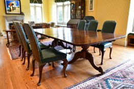 A GOOD MAHOGANY DOUBLE PILLAR DINING TABLE with loose leaf, on two pillars with tripod curving