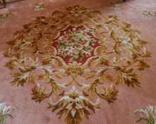 A LARGE FRENCH AUBUSSON WOOL CARPET, Made by TAI PING CARPETS OF HONG KONG, CIRCA. 1990, with pink