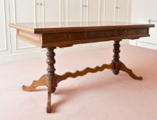 A LONG OAK TABLE with three drawers, turned supports and tripod legs. 5ft 7ins long x 2ft 2ins