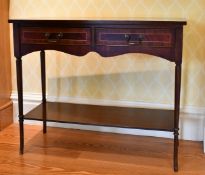A REPRODUCTION MAHOGANY NARROW SIDE TABLE with two frieze drawers, turned legs with under-tier.