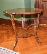 A VICTORIAN ROSEWOOD INLAID FOLDING FLAP CLOVERLEAF TABLE with curving legs, under-tier and castors.