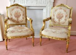 A GOOD LOUIS XVI STYLE GILTWOOD SUITE with tapestry covers, comprising settee and pair of