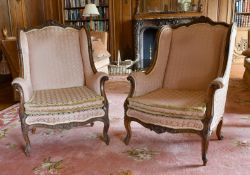 A GOOD PAIR OF MAHOGANY WING ARMCHAIRS with show wood frame, loose padded seats, on cabriole legs.