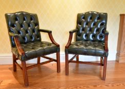 A GOOD PAIR OF MAHOGANY BUTTONED BACK ARMCHAIRS with curving arms and square chamfered legs.