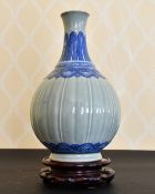 A CHINESE CELADON AND BLUE BULBOUS VASE. 12ins high.