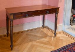 A LATE REGENCY MAHOGANY PLAIN SIDE TABLE with frieze drawer, on fluted turned legs. 3ft 6ins long.