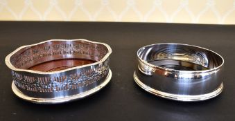 A CIRCULAR SILVER WINE COASTER and A PIERCED PLATED WINE COASTER (2).